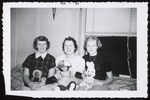 Three Westbrook Junior College Students Holding Dolls, 1956