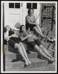 Three Students Sunbathing on the Steps to Proctor Hall, Westbrook Junior College, March 1962