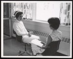 Dental Hygiene Student Chatting with Director, Westbrook Junior College, 1961 by Wendell White Studio