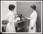 Two Dental Hygiene Students at Autoclave, Westbrook Junior College, 1962 by Wendell White Studio