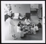 Two Dental Hygiene Students Read to Clinic Visitors, Westbrook Junior College, 1964