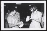 Two Nursing Students Examine Their Caps, Westbrook Junior College, 1966