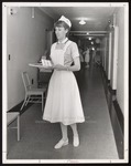 Nursing Student Carrying Tray, Westbrook Junior College, 1966